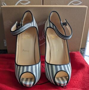 Christian Louboutin Black and White Striped Heels With ankle strap.